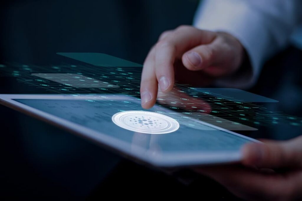 A hand interacting with a futuristic tablet interface with icons